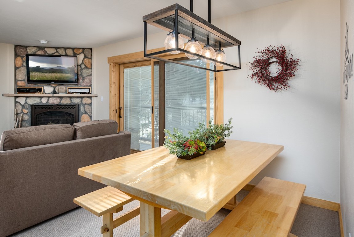 500 4 O Clock Road, Unit A22 Breckenridge, CO 80424 - Photo 3 of 16 a living room with furniture and a flat screen tv