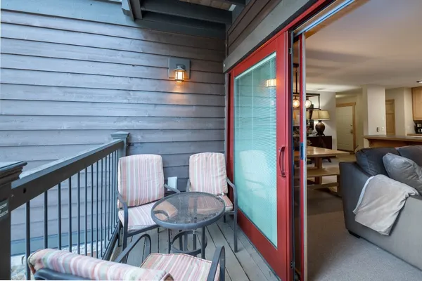 a kitchen with a table and chairs in it