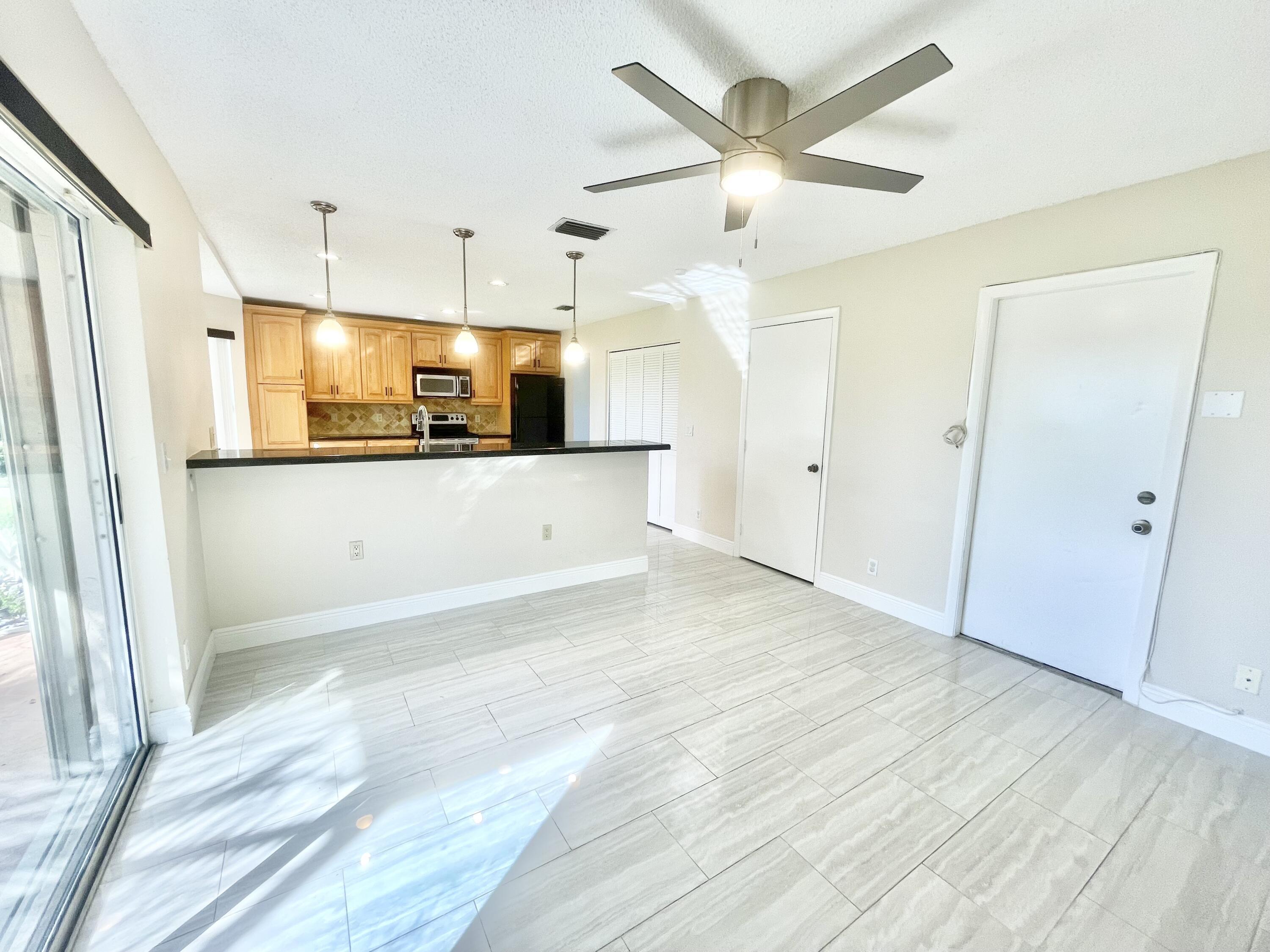 10779 Buttonwood Lake Drive Boca Raton, FL 33498 - Photo 21 of 35 Open Kitchen to Family Room