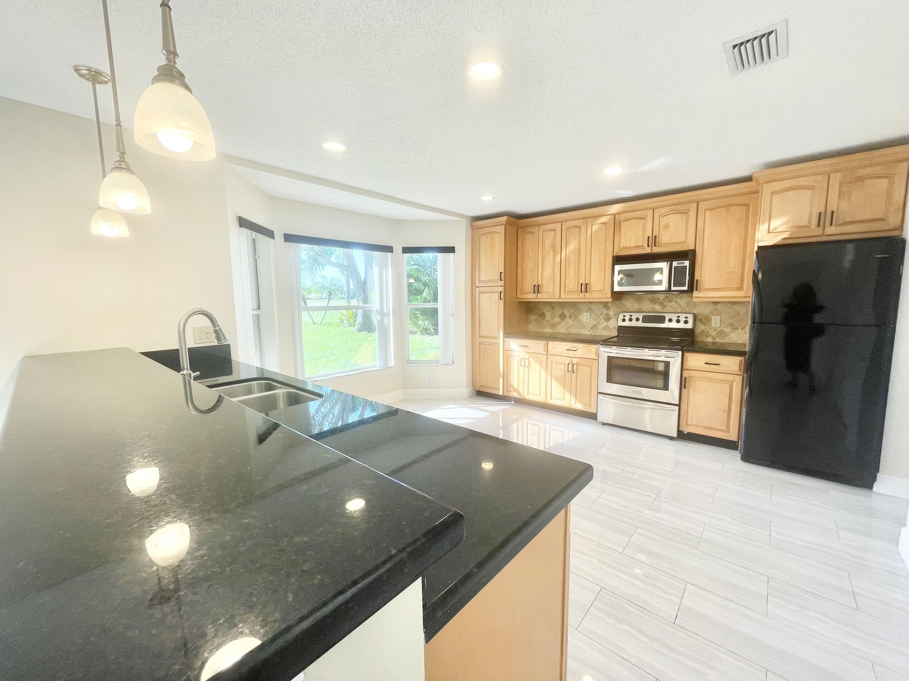 10779 Buttonwood Lake Drive Boca Raton, FL 33498 - Photo 7 of 35 Spacious Updated Kitchen