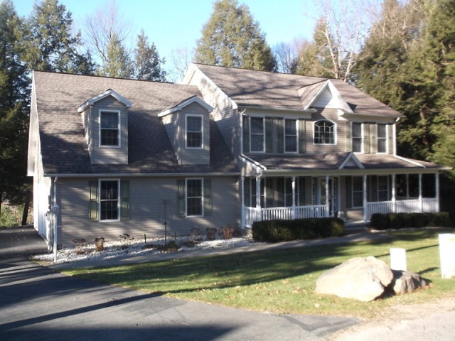 105 Summit Court Clarion, PA 16214 - Photo 1 of 1 a front view of a house with a yard table and chairs