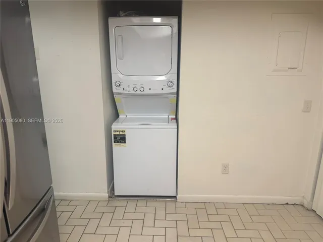 a view of a house with a small yard and plants