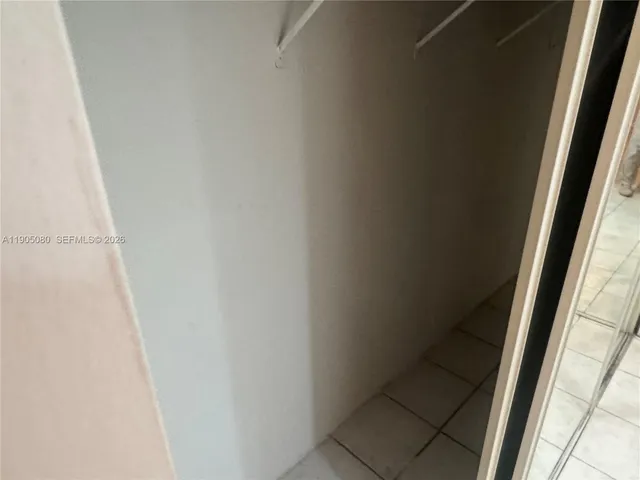 a swimming pool with lots of trees in the background