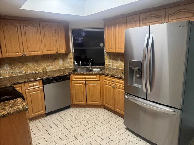 an empty room with wooden floor