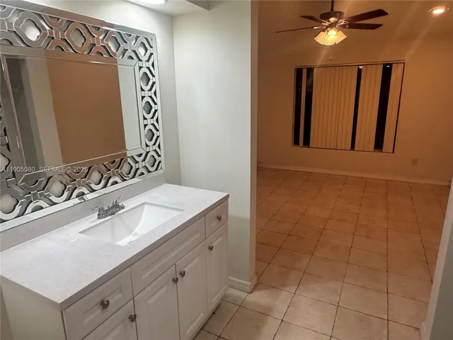 a bathroom with a toilet sink and shower