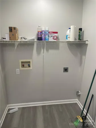 a view of storage and utility room with two washing machine