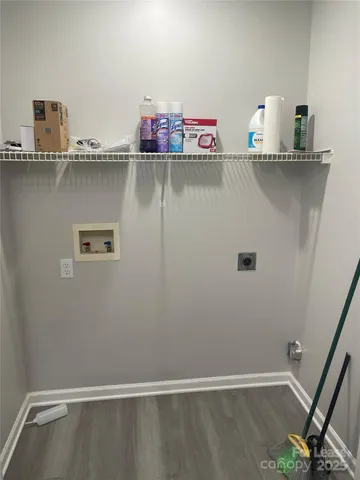 a view of storage and utility room with two washing machine