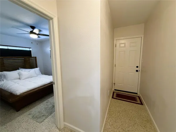 a bedroom with a bed and a rug