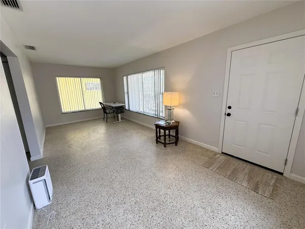 wooden floor and chair in a room
