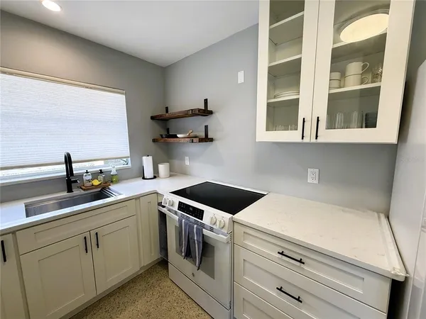 a kitchen with a sink and cabinets