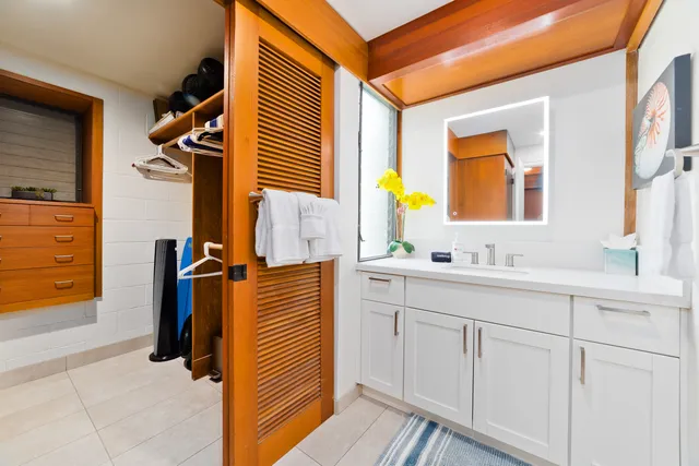 a bathroom with a sink a mirror and a bathtub