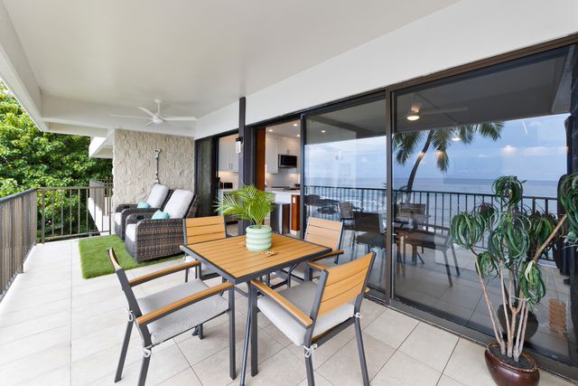a view of a dinning table and chairs in patio