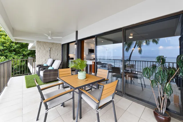 a view of a dinning table and chairs in patio