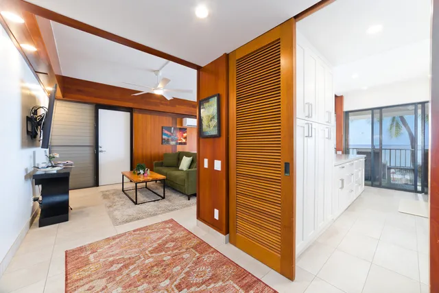 a view of a porch with a table and chairs