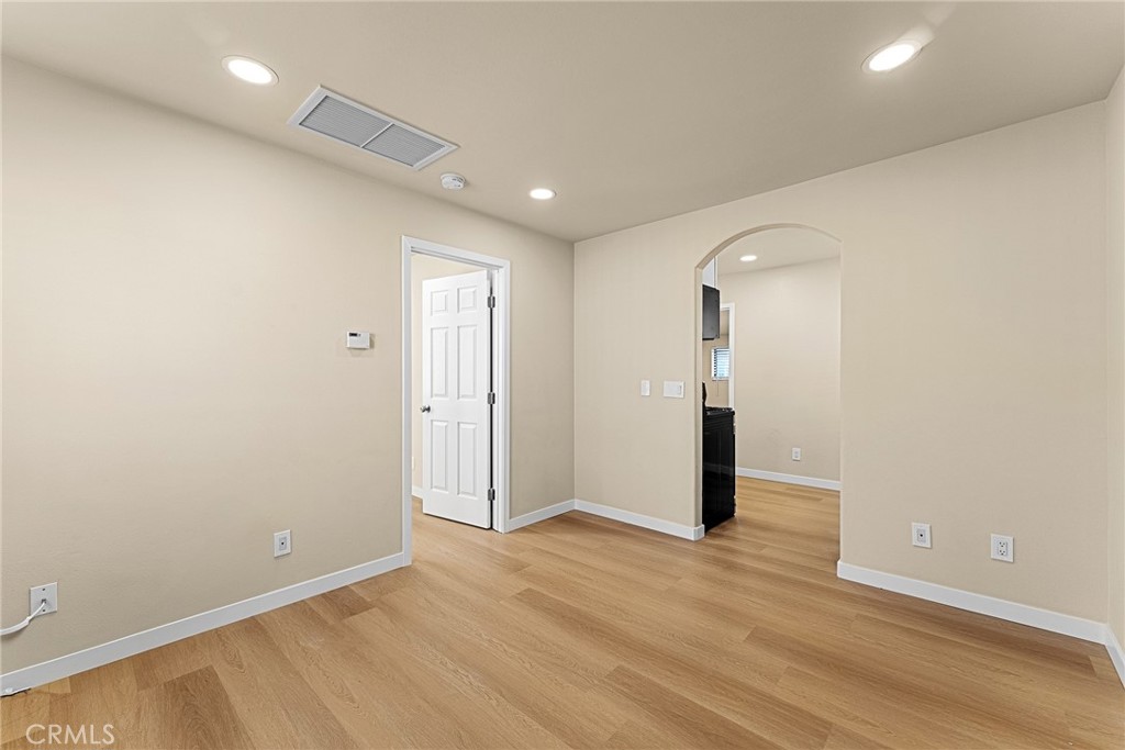 2857 Mulberry Street Riverside, CA 92501 - Photo 5 of 20 an empty room with wooden floor and entrance