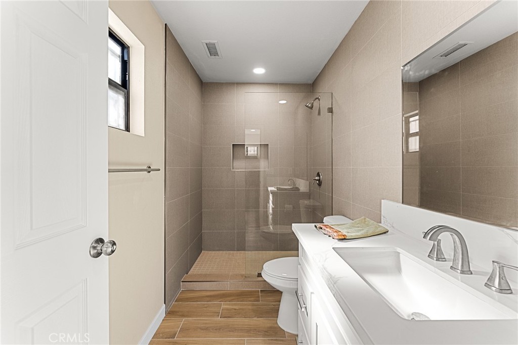 2857 Mulberry Street Riverside, CA 92501 - Photo 7 of 20 a bathroom with a sink toilet and shower