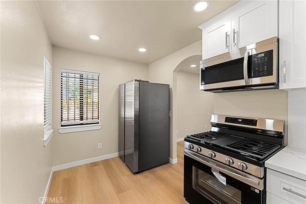 2857 Mulberry Street Riverside, CA 92501 - Photo 9 of 20 a kitchen with stainless steel appliances granite countertop a stove and a microwave