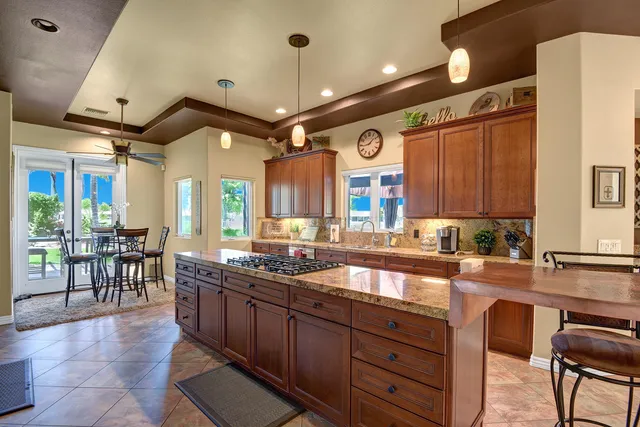 a large kitchen with lots of counter space and a sink