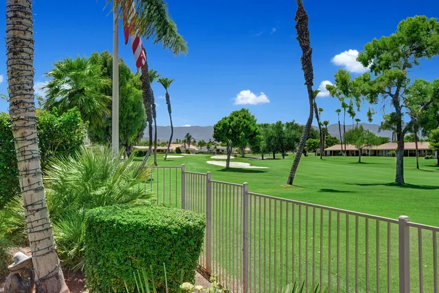 a view of a park with swings and slides