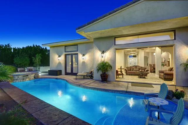 a bathroom with a sink mirror and toilet