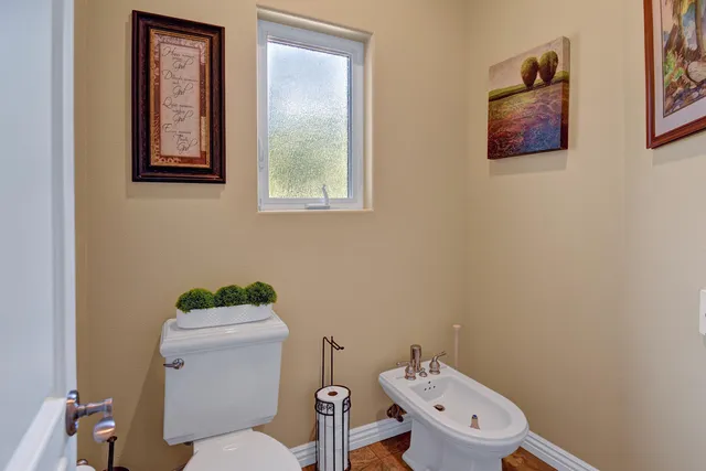 a bathroom with a sink a large mirror and a shower