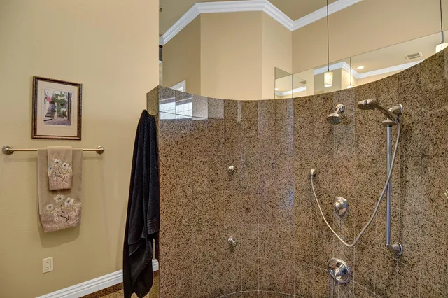 a bedroom with a bed a couch and a window