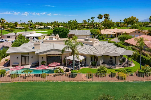a group of people sitting in front of a building