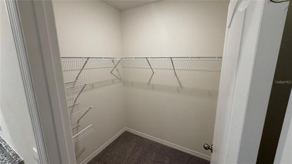 1446 Isleta Loop Kissimmee, FL 34741 - Photo 11 of 27 a view of small space with empty racks