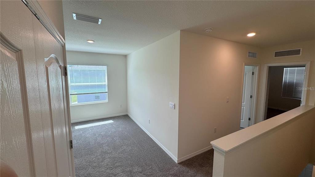 1446 Isleta Loop Kissimmee, FL 34741 - Photo 17 of 27 a view of hallway