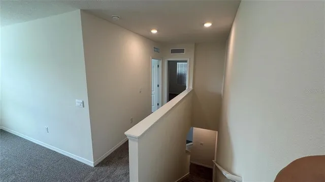 a bathroom with a granite countertop toilet a sink and shower