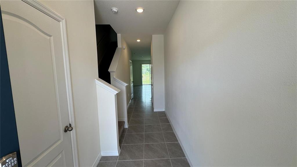 1446 Isleta Loop Kissimmee, FL 34741 - Photo 6 of 27 a view of a hallway with entryway