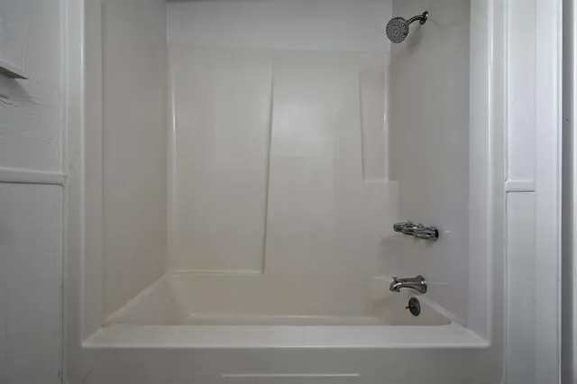 a close up of a bathtub curtain
