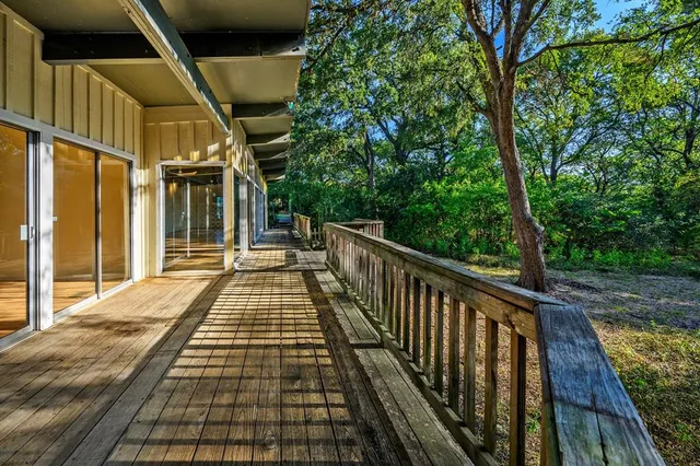 a view of balcony with wooden floor