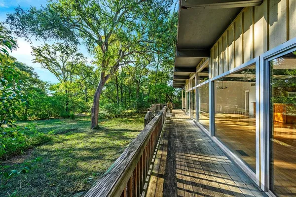 a view of balcony with yard