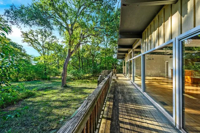 a view of balcony with yard