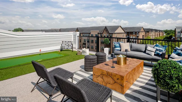 a view of a patio with couches dining table and chairs
