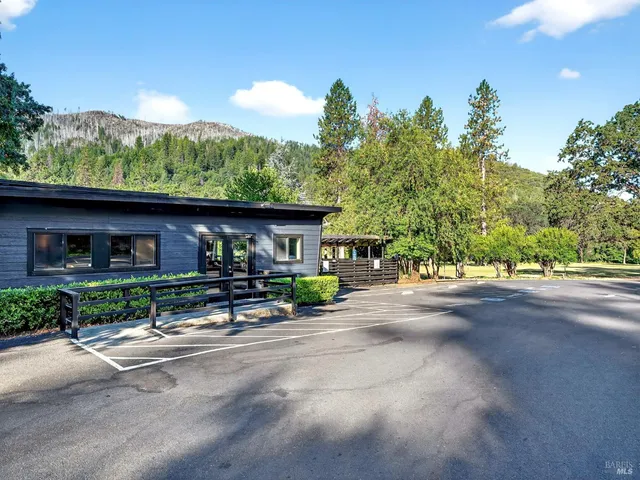 a view of a room with furniture and wooden floor