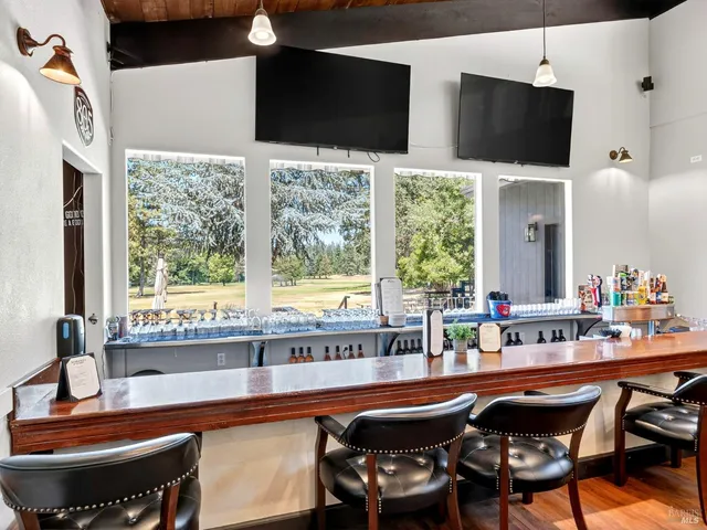 a view of backyard with a table and chairs