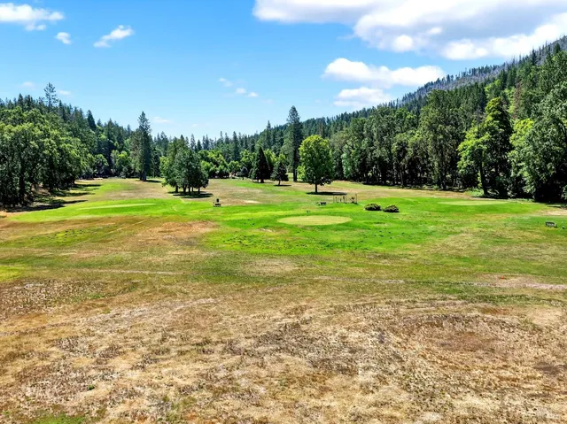 a view of a swimming pool with an outdoor space and seating area