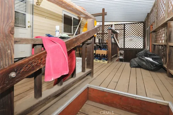 a view of balcony with wooden floor