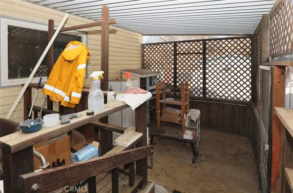 a balcony with table and chairs