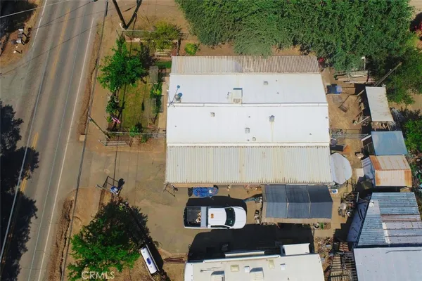 an aerial view of a house with a yard