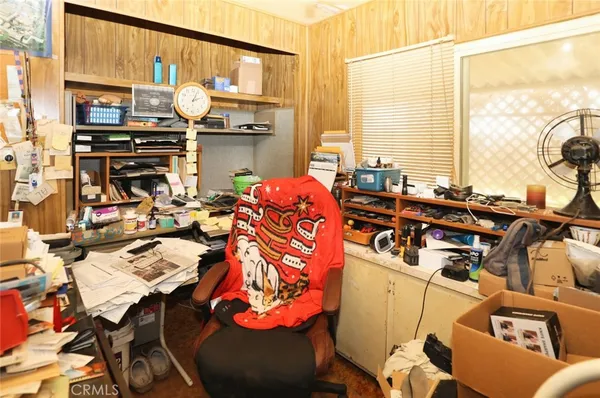 a very nice looking room with a large window and furniture