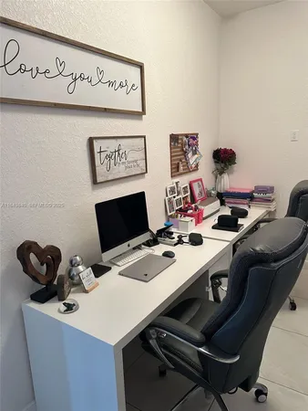 a view of a workspace with furniture