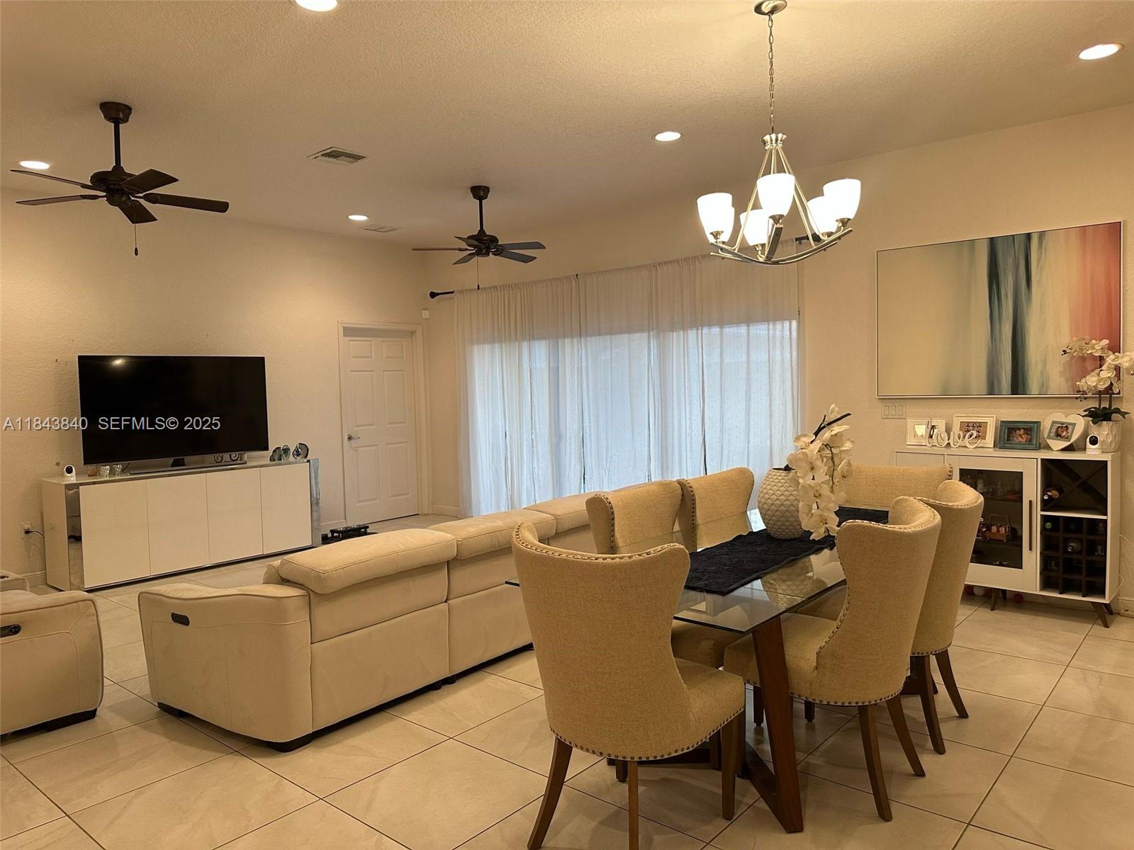 210 Southwest 4th Street, Unit 210 Dania Beach, FL 33004 - Photo 2 of 22 a view of a dining room with furniture