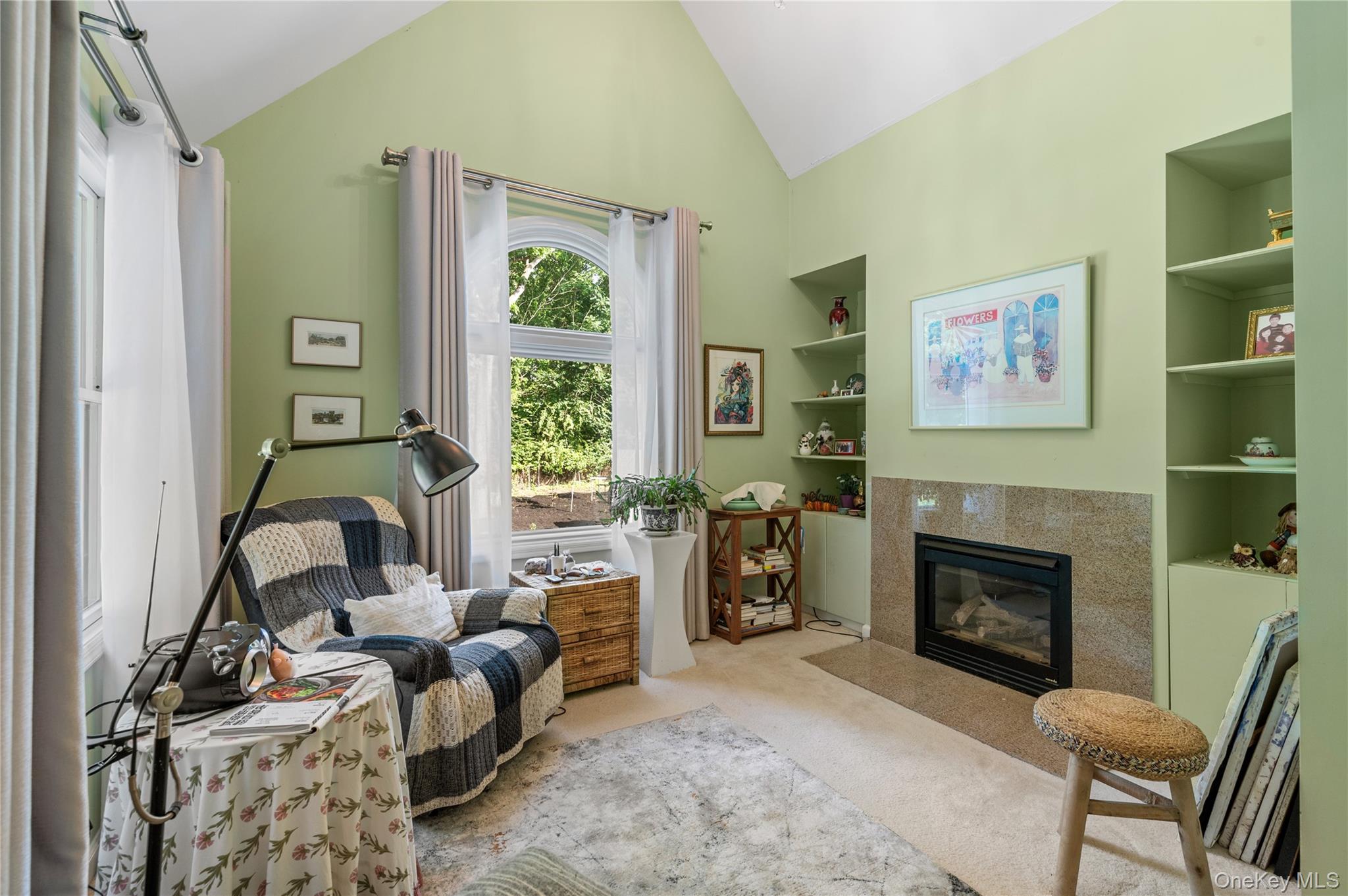 91 Bennetts Road East Setauket, NY 11733 - Photo 21 of 31 Master Bedroom Sitting room with carpet flooring, a fireplace with flush hearth, built in features, and high vaulted ceiling