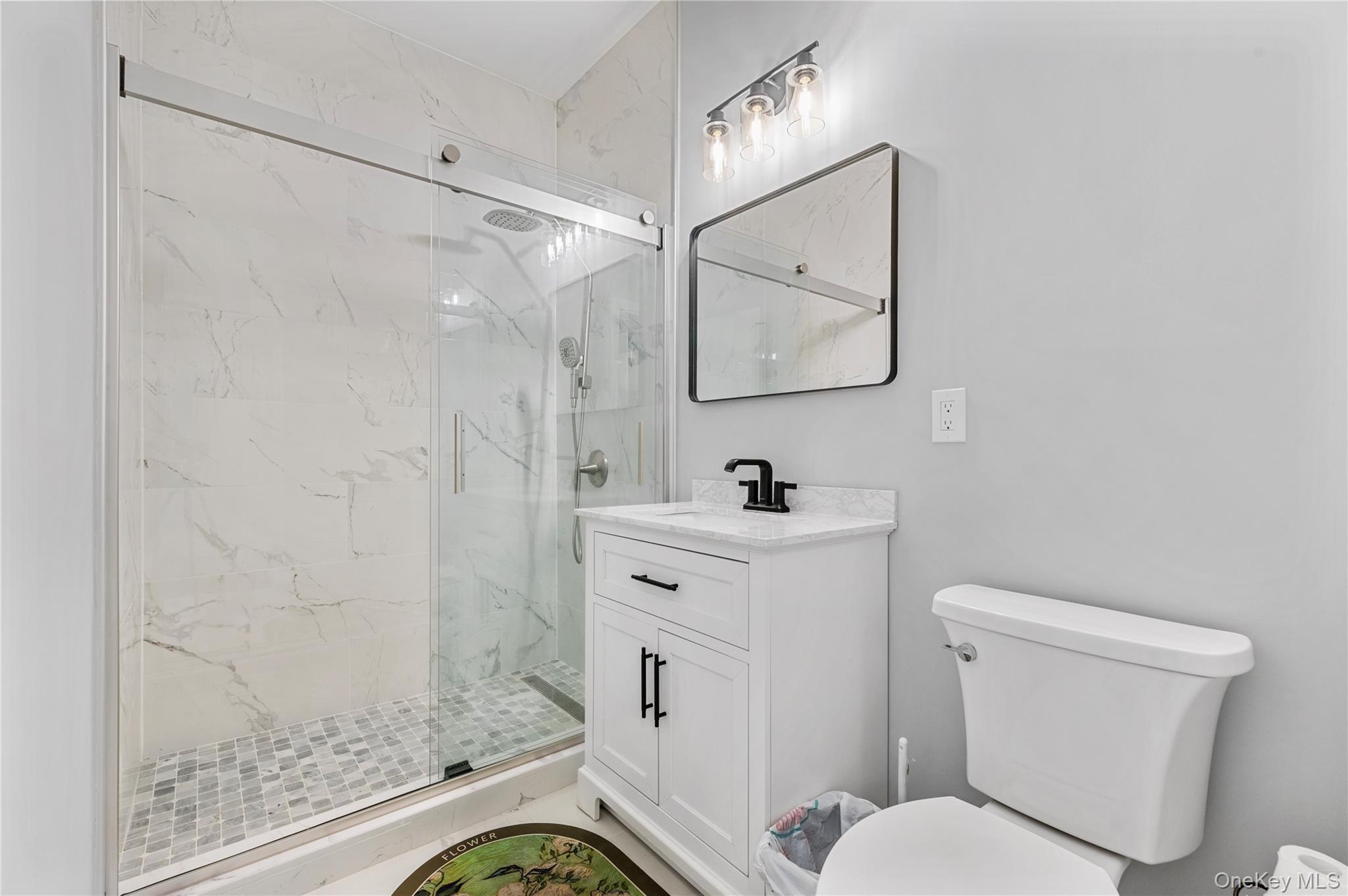 91 Bennetts Road East Setauket, NY 11733 - Photo 25 of 31 Bathroom with a marble finish shower and vanity