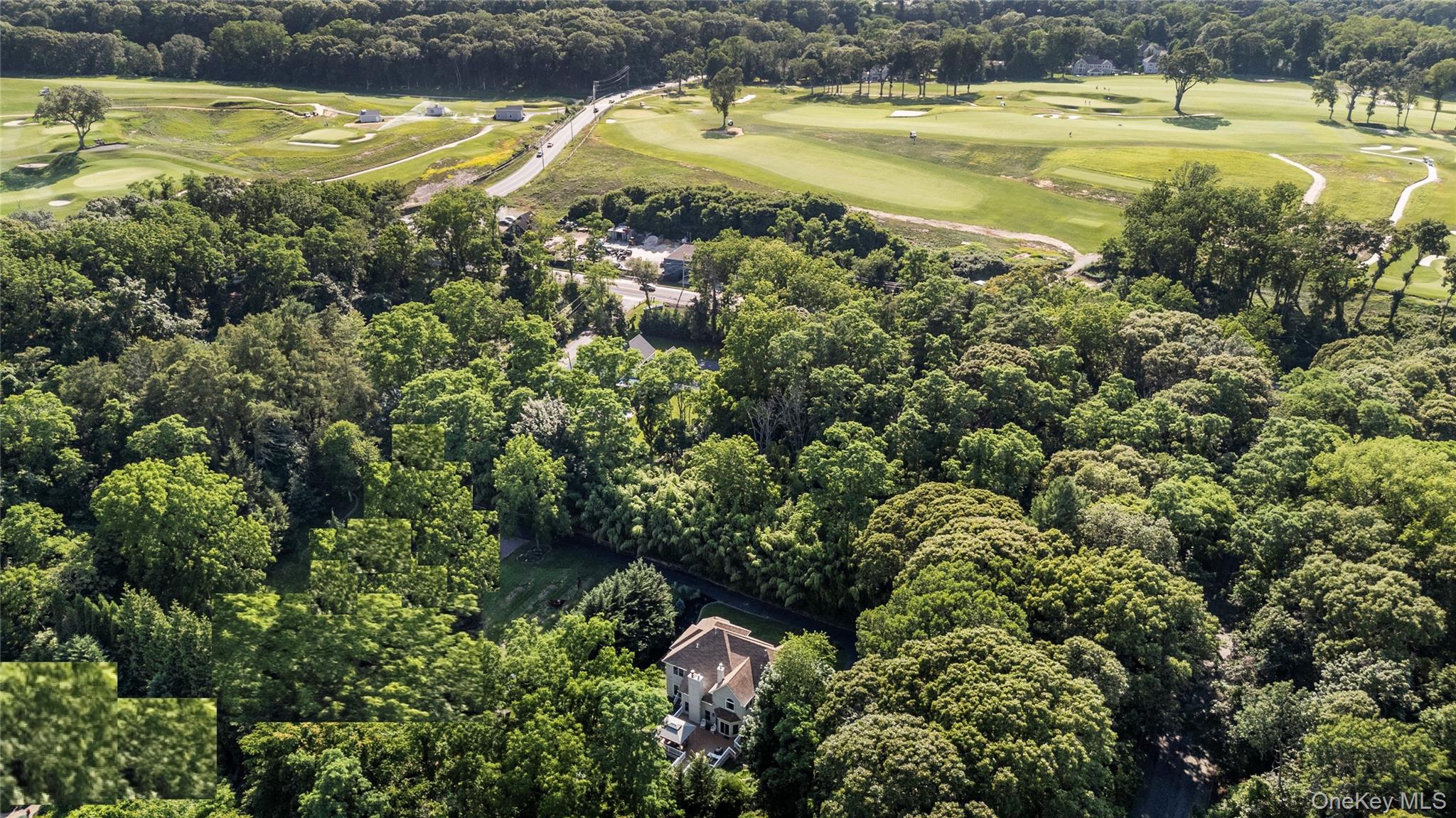 91 Bennetts Road East Setauket, NY 11733 - Photo 3 of 31 Aerial view of property and surrounding area with a golfclub and a forest