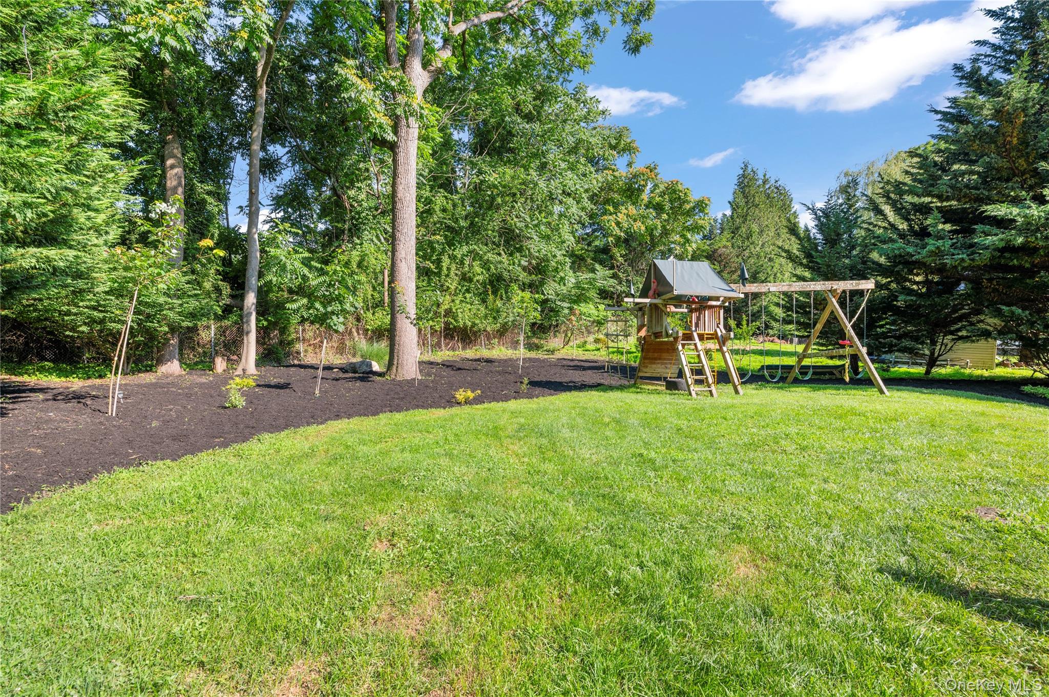 91 Bennetts Road East Setauket, NY 11733 - Photo 31 of 31 View of grassy yard featuring a playground
