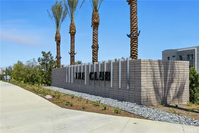 a view of a brick building next to a yard